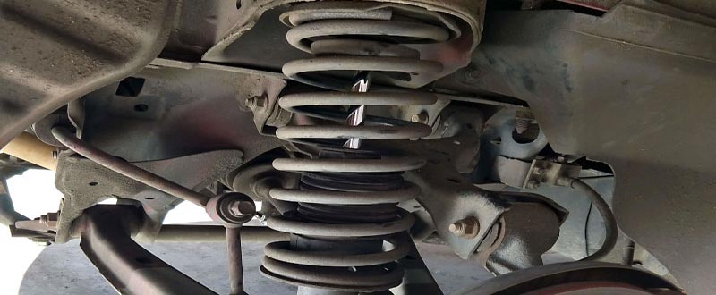 What Causes A Damaged Or Broken Coil Spring?